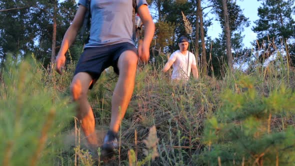 Two Tourists Descend From the Mountain