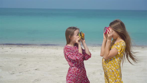 Little Girls Having Fun Enjoying Vacation on Tropical Beach