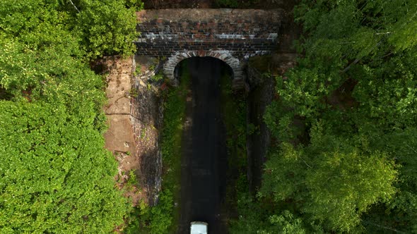 Aerial View of the Car Entering the Tunnel