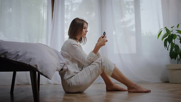 Woman Checks Social Networks to Distract From Loneliness