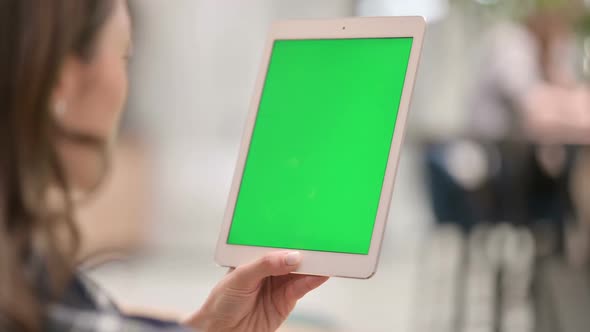 Female Using Tablet with Green Chroma Key Screen