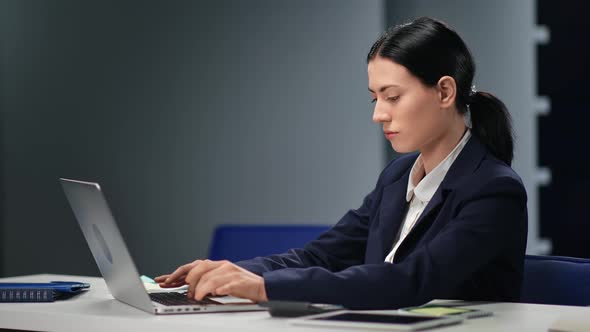 Focused Business Woman in Suit Working Typing Use Laptop Application