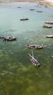 Vertical Video Boats in the Ocean Near the Coast of Zanzibar Tanzania