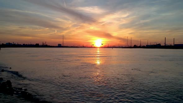 Smooth push in shot towards the antwerp international port at sunset