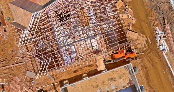 Top Aerial View New Framing Stick Built Building of Beams on New Home Under Construction