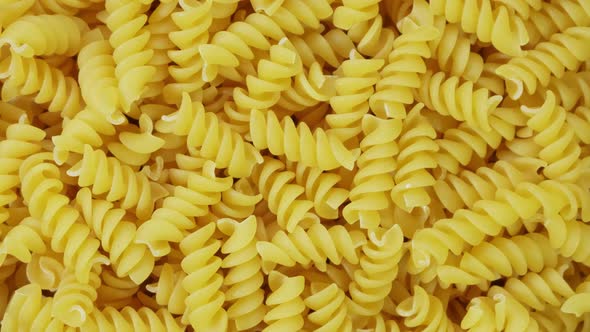 Closeup of Uncooked Italian Spiral Pasta, Slow Rotation
