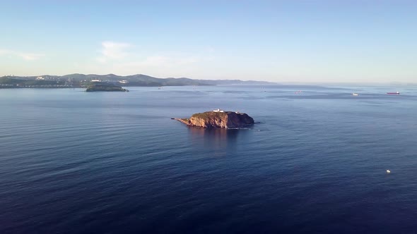 Beautiful Drone Flight From the Rocky Skryplev Island with a Lighthouse