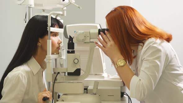 Young Professional Talented Doctor Measuring the Eyesight of Patient