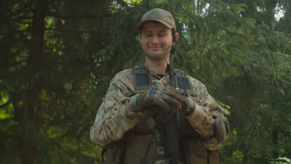 Joyful Soldier Simulating Radio Call Using Walkietalkie Outdoors