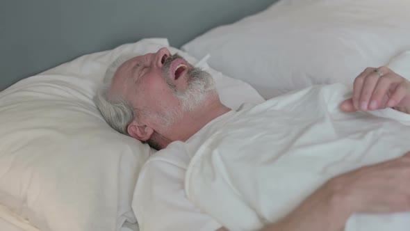 Old Man Waking Up From Nightmare in Bed