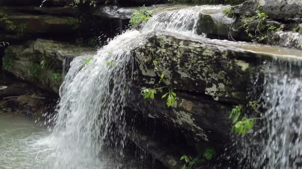 Waterfall Flowing Over Boulder in Slow Motion
