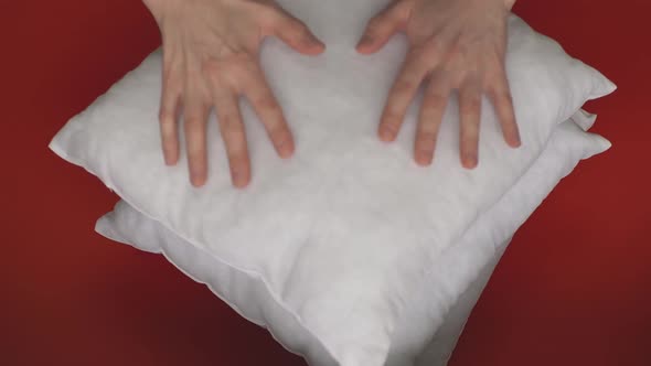 White Pillow on a Red Background