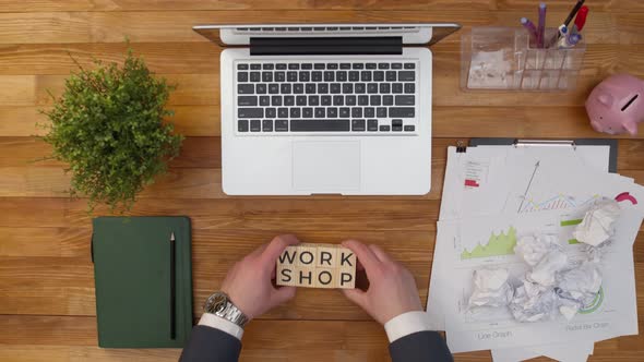 Word Workshop on Office Table is Composed of Wooden Cubes with Letters