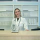 Smiling Female Doctor at the Reception Looking at the Camera - VideoHive Item for Sale