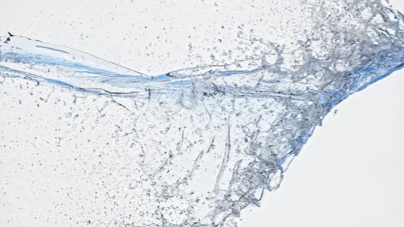 Super Slow Motion Shot of Side Water Splash Isolated on White Background at 1000Fps