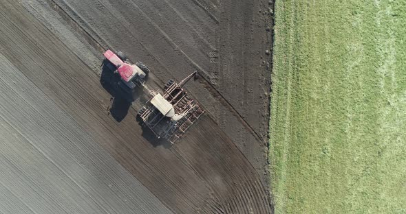 Agriculture, Farm Tractors Plow the Earth in Field, Dust in the Field, View From Height, Grain