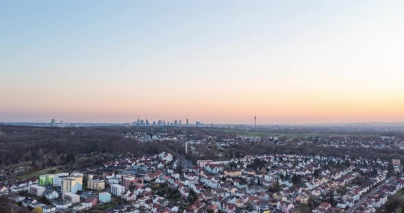 Ascending Aerial View of Residential Neighborhoods and Tall Skyscrapers in Large City of Frankfurt