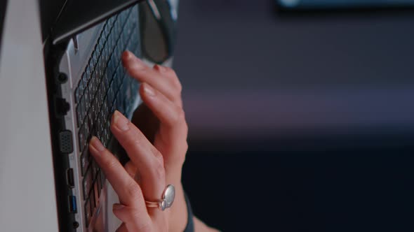 Closeup of Businesswoman Hands on Keyboard Sitting at Desk in Startup Company Office