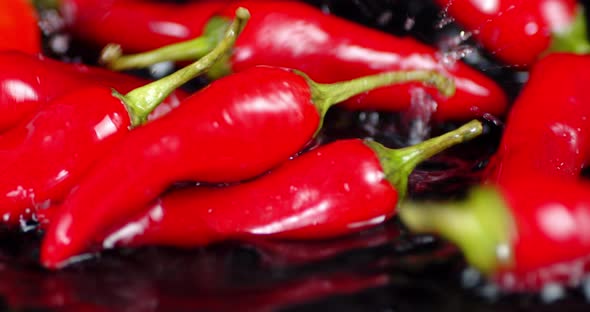 Red Pepper Falling Into Water with a Splash