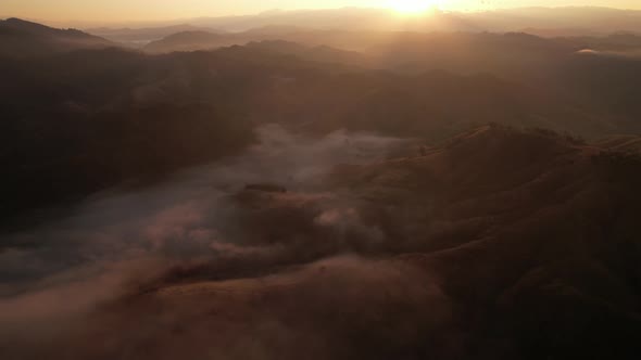 4K Aerial view of Mountains landscape with morning fog.