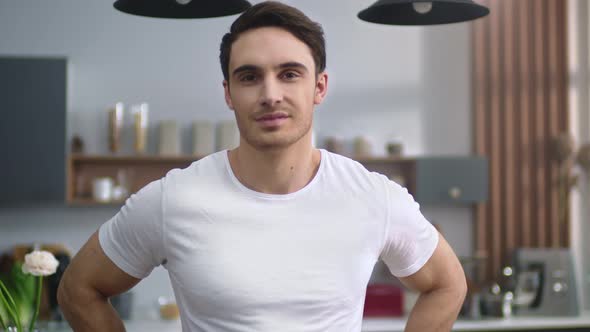 Portrait of Attractive Man Looking Camera at Kitchen. Sporty Guy Smiling Home