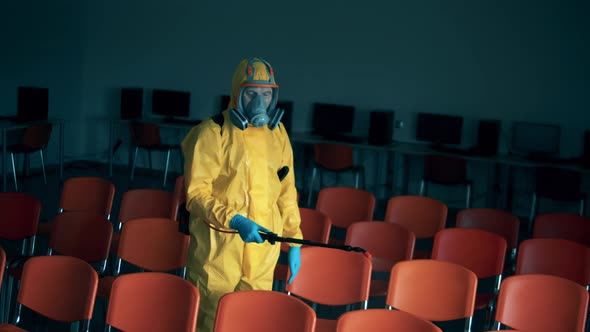 Computer Hall Is Getting Disinfected By a Sanitation Worker