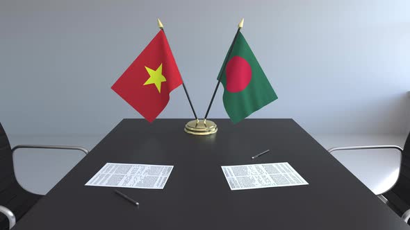 Flags of Vietnam and Bagladesh on the Table alt