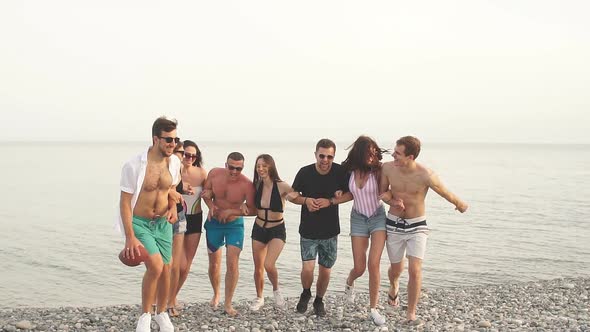 Multiracial Group of Friends Walking at Beach