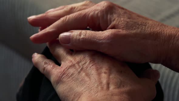 Closeup Hands of Old Caucasian Woman - She Sits in Living Room