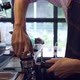 Close up Asian barista at work during making coffee in coffee cafe. - VideoHive Item for Sale