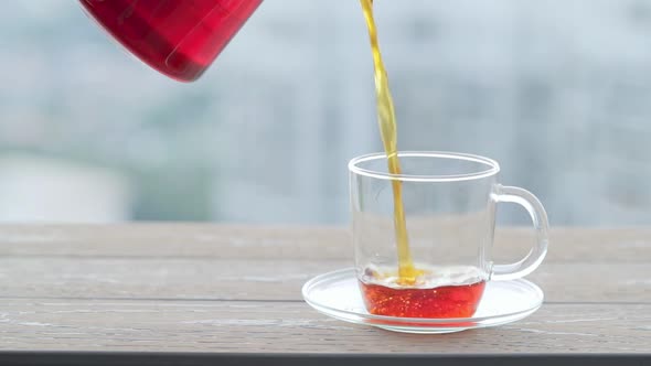 Coffee pot pouring into a glass