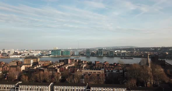 An aerial drone view of Millwall and Island Gardens towards Thames river of London