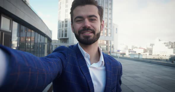 Shot of Businessman Making Video Call Standing Outdoors in City