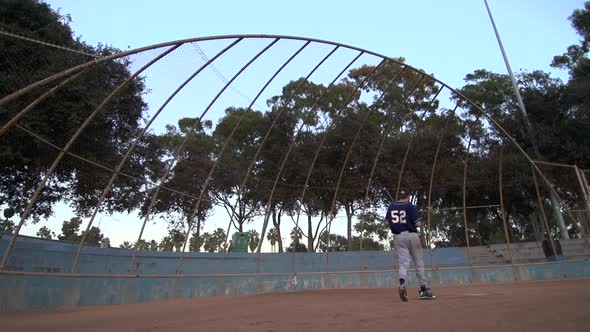 A baseball player practicing his swing.