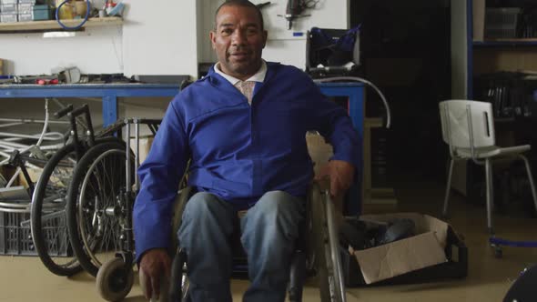 Disabled man with wheelchair looking at the camera