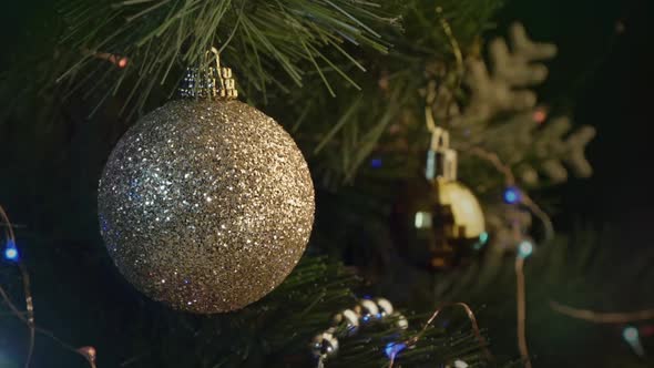 Background with Golden Baubles on Christmas Tree
