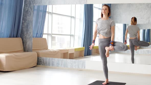 Young Attractive Woman Practicing Yoga