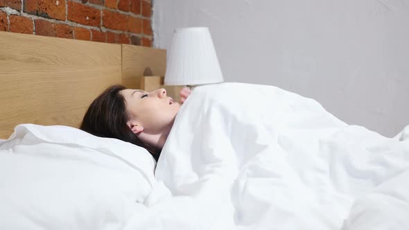 Coughing Sick Woman Lying in Bed at Night