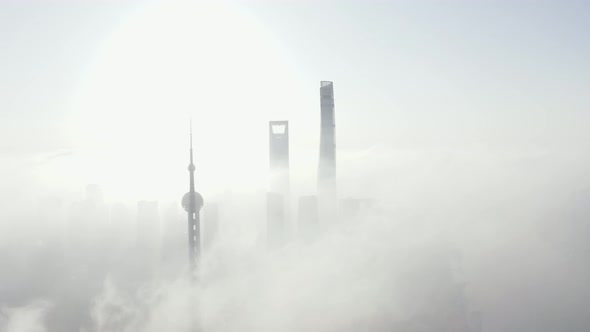 Aerial view of Shanghai financial district in early morning fog, China.