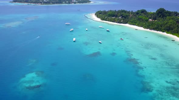 Drone seascape of marine shore beach voyage by blue lagoon with sand background