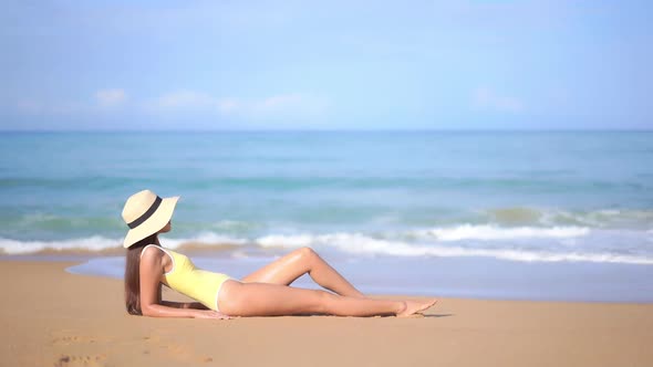 Asian woman enjoy around beautiful beach sea ocean