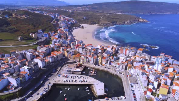 Coastal city with port and beach