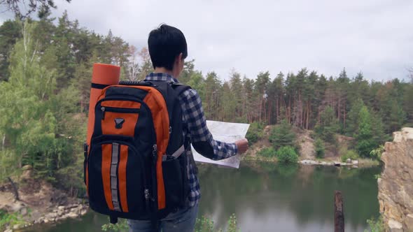 Woman with Rucksack Looking for Best Road