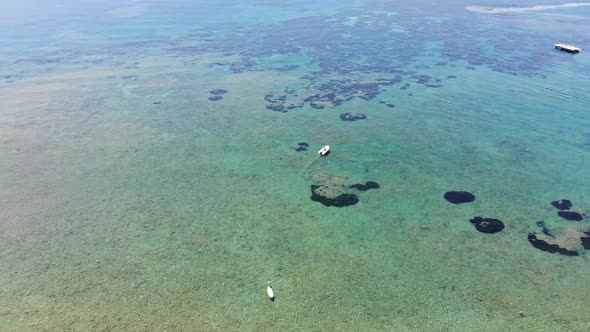 Beautiful aerial footage of the clear ocean sea off the Greek coast of Greece in Corfu