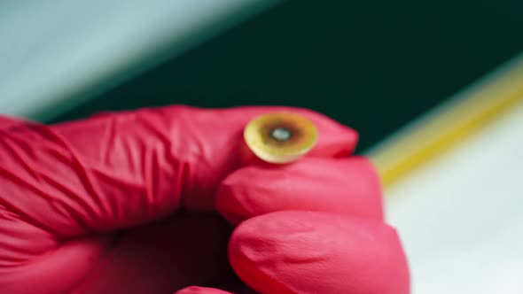 Medical technician making eye prosthesis