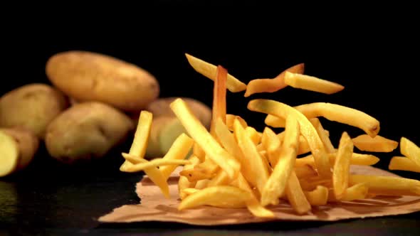 Super Slow Motion of the French Fries Falls on the Table