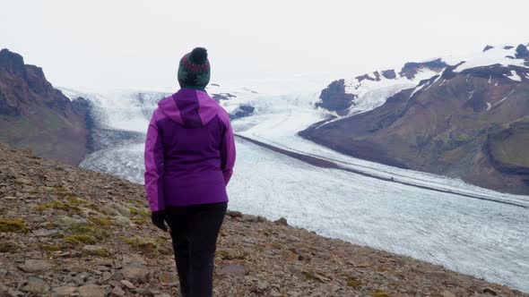 Women Rises on a Mountain Ridge