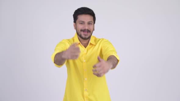 Young Happy Bearded Indian Businessman Looking Excited While Giving Thumbs Up