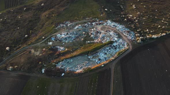 Aerial Drone View of Large Garbage Landfill Near Agricultural Land