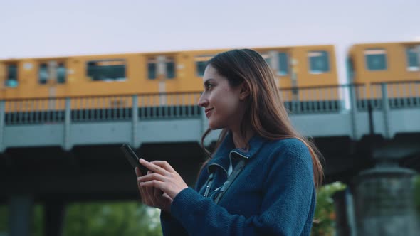 Young woman looking at her phone for directions